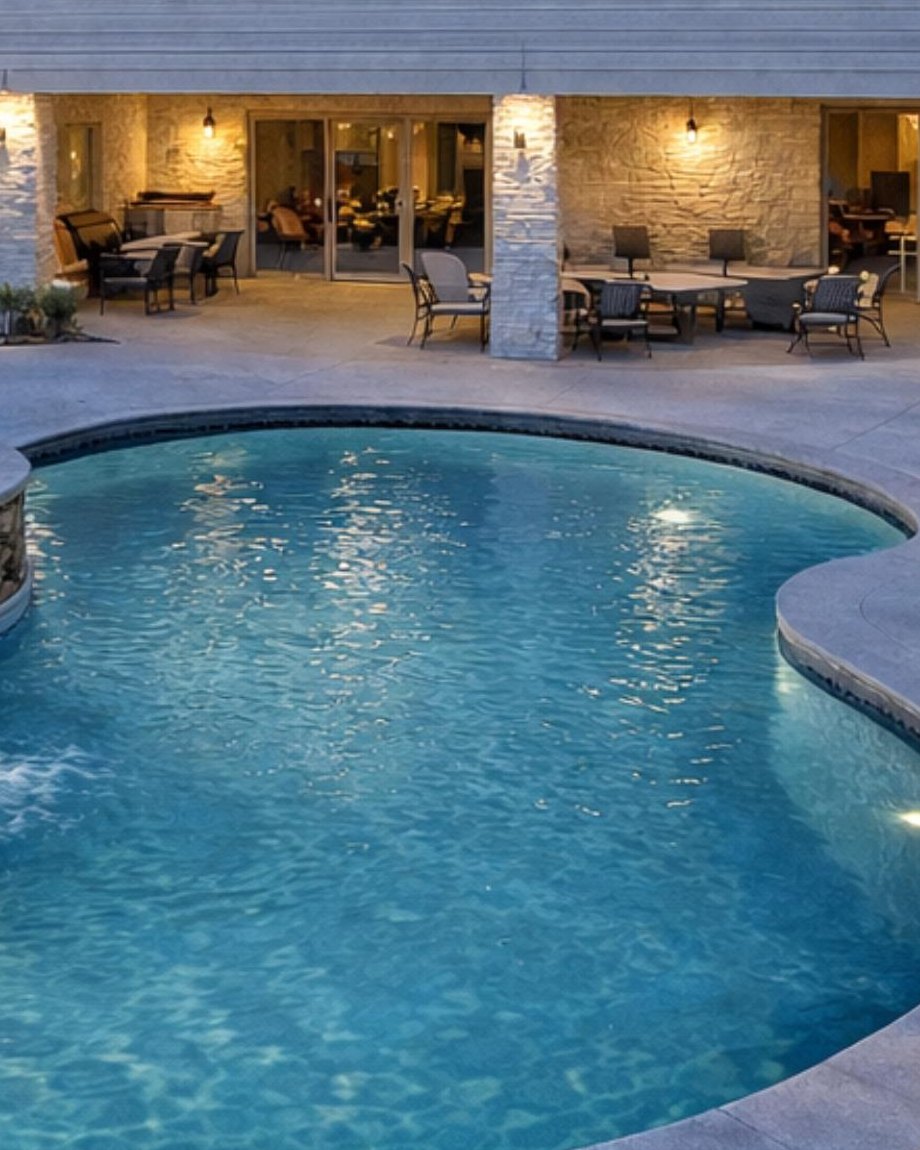 Covered outdoor dining and pool at 104 Wanakah
